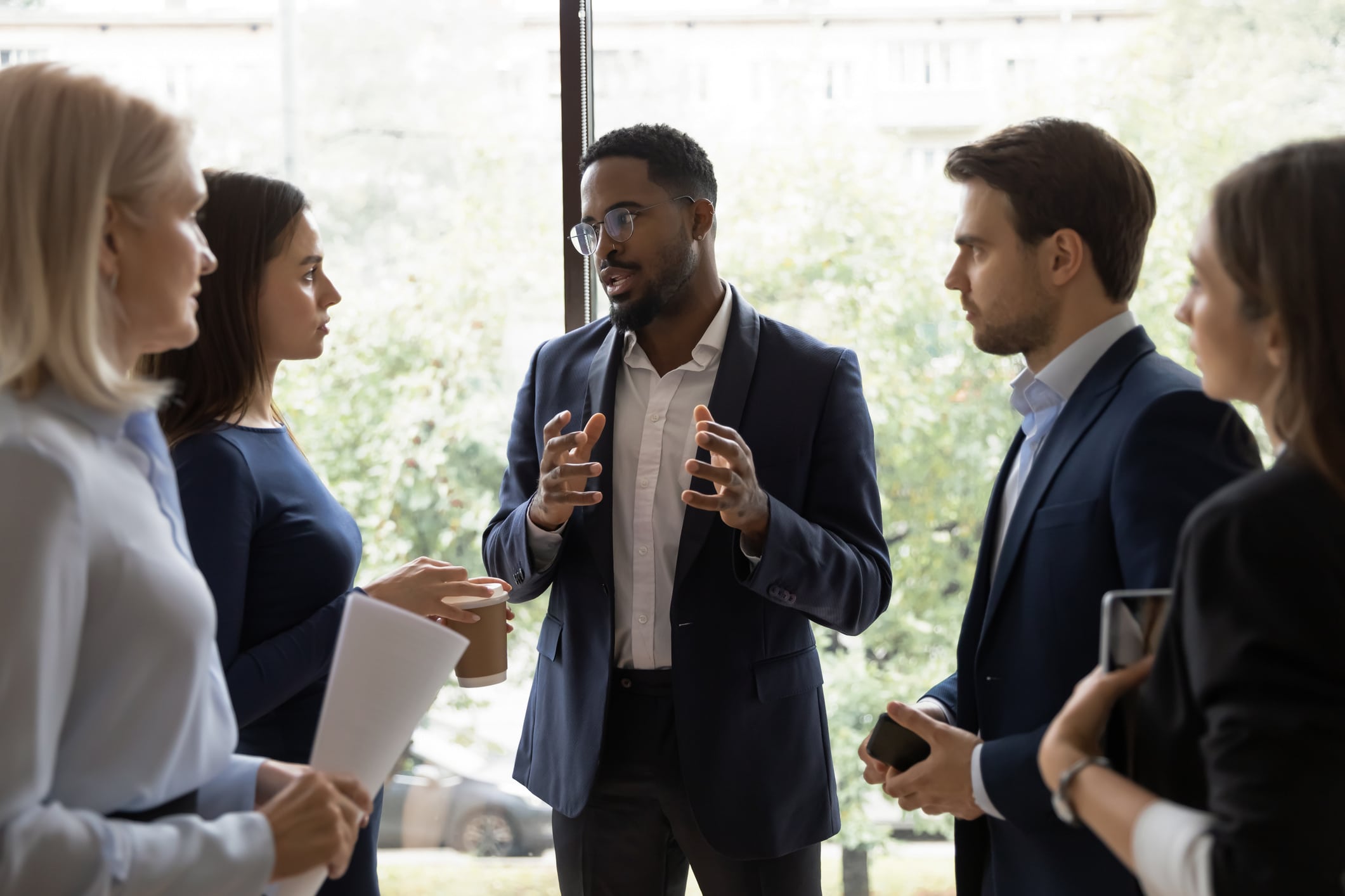 coworkers discussing work in the office
